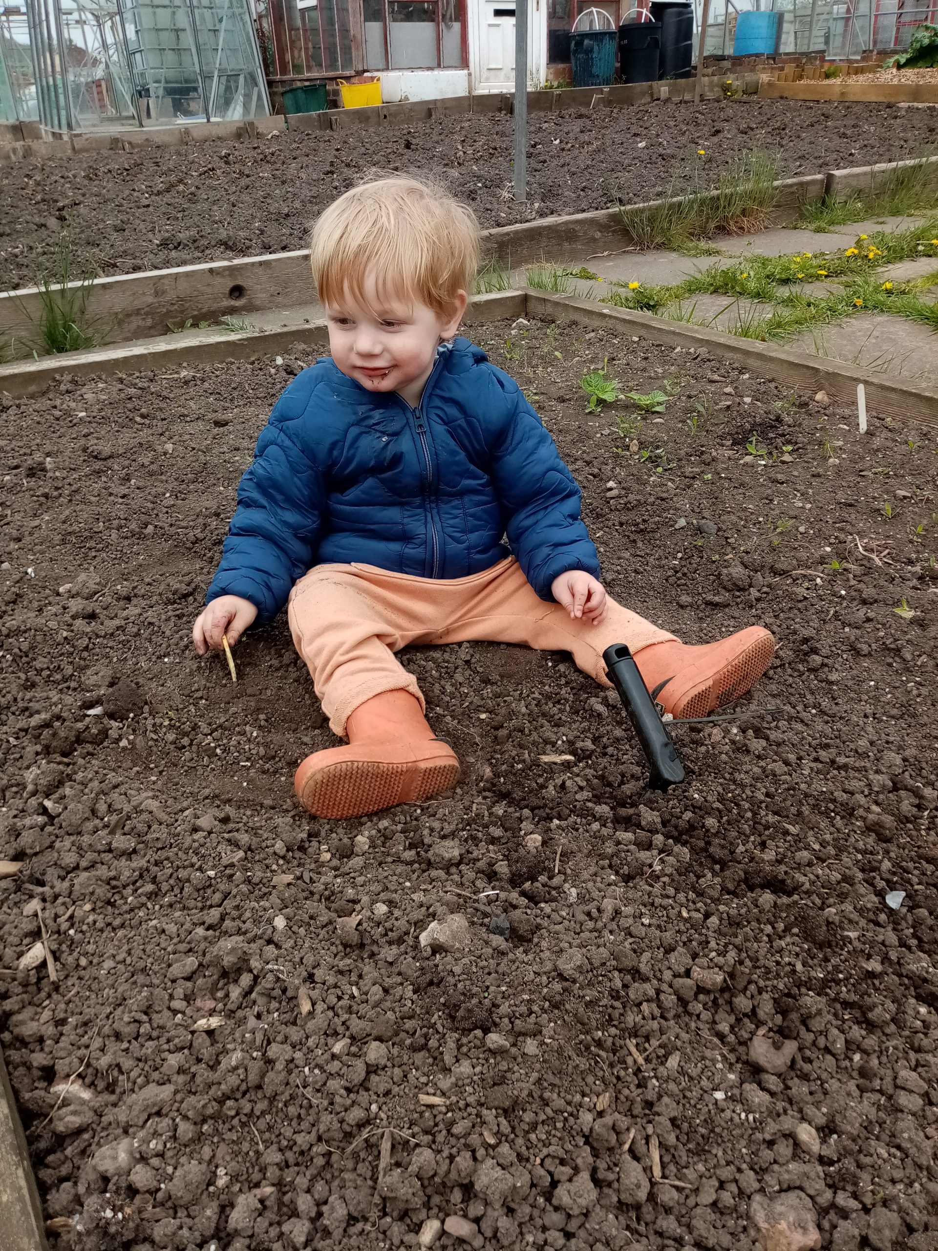Happy toddler in the dirt