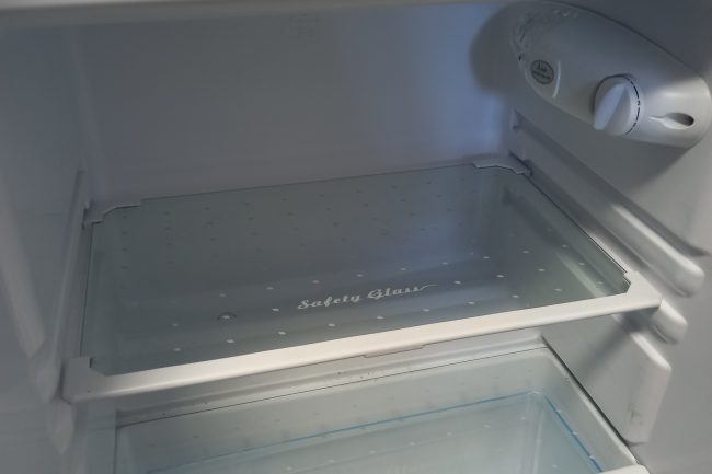 Inside an empty fridge